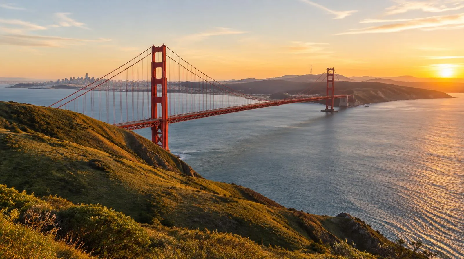 Golden Gate Bridge and California coastal hills at golden hour